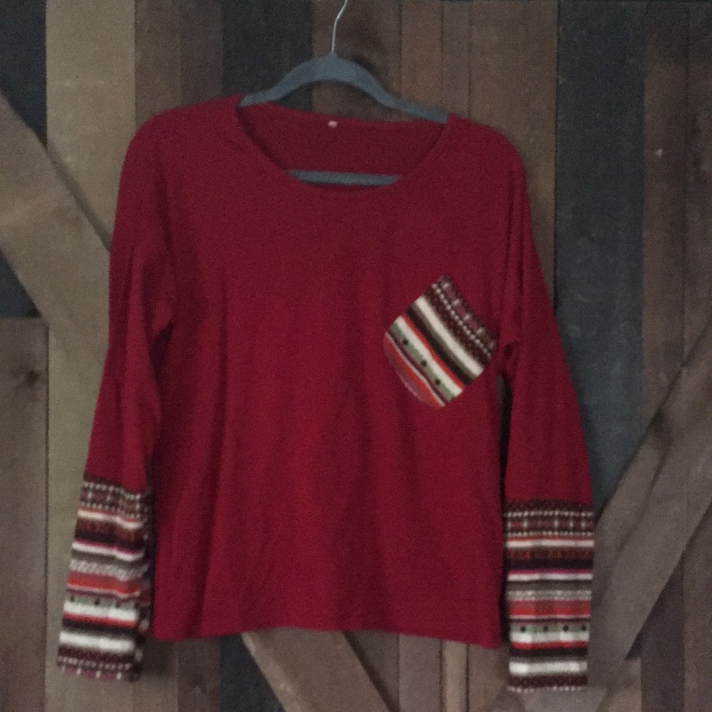 Ladies large top with thumb holes in sleeves. Cute pocket on front.